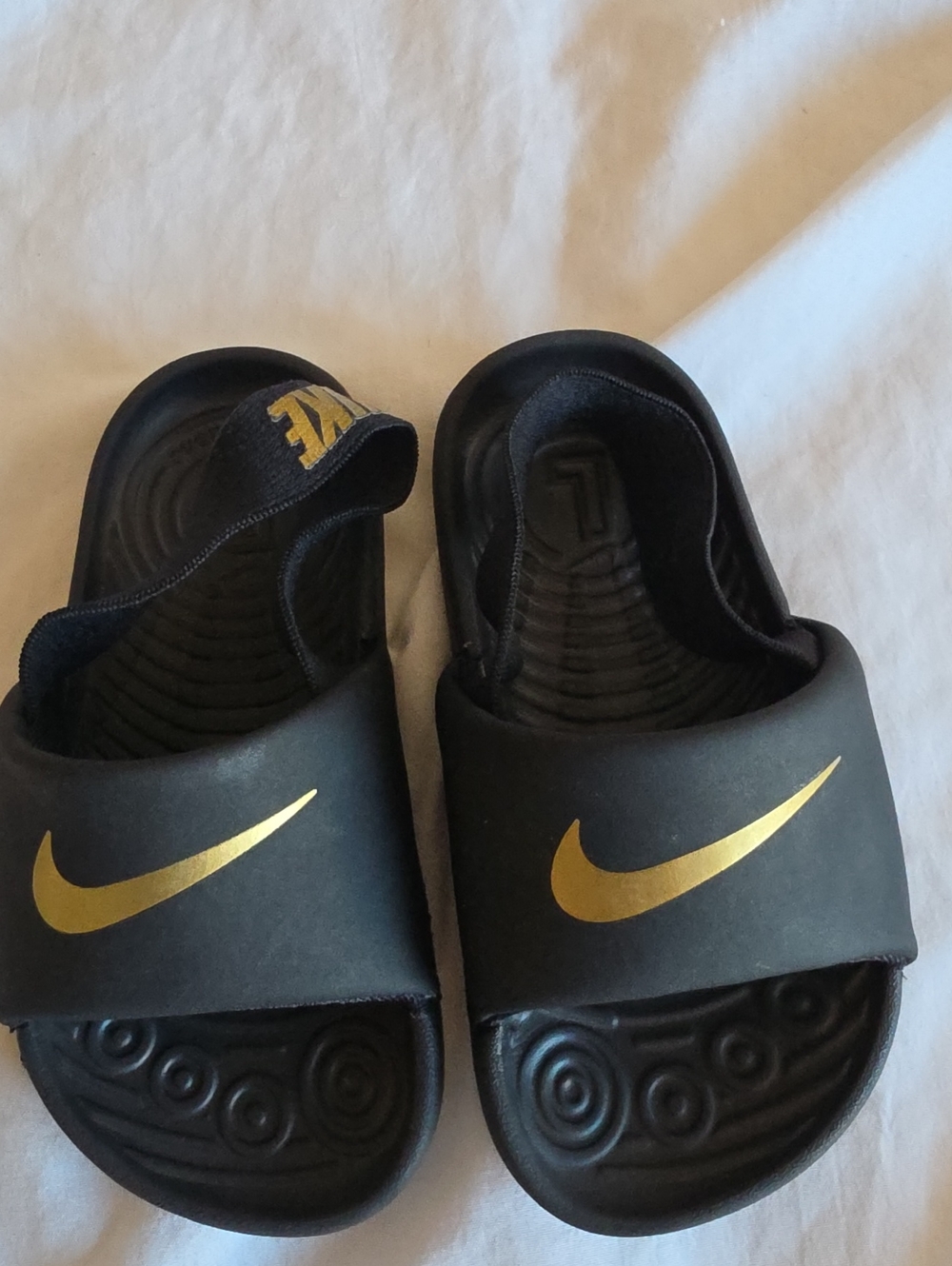 Nike Toddler Black Slide Sandals with Gold Swoosh